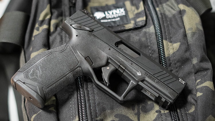 Taurus TX22 on top of a Multicam Black Pistol Range Bag